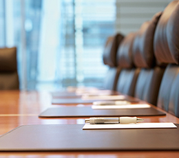 A formal boardroom setting, symbolizing college administration, governance, and leadership meetings.